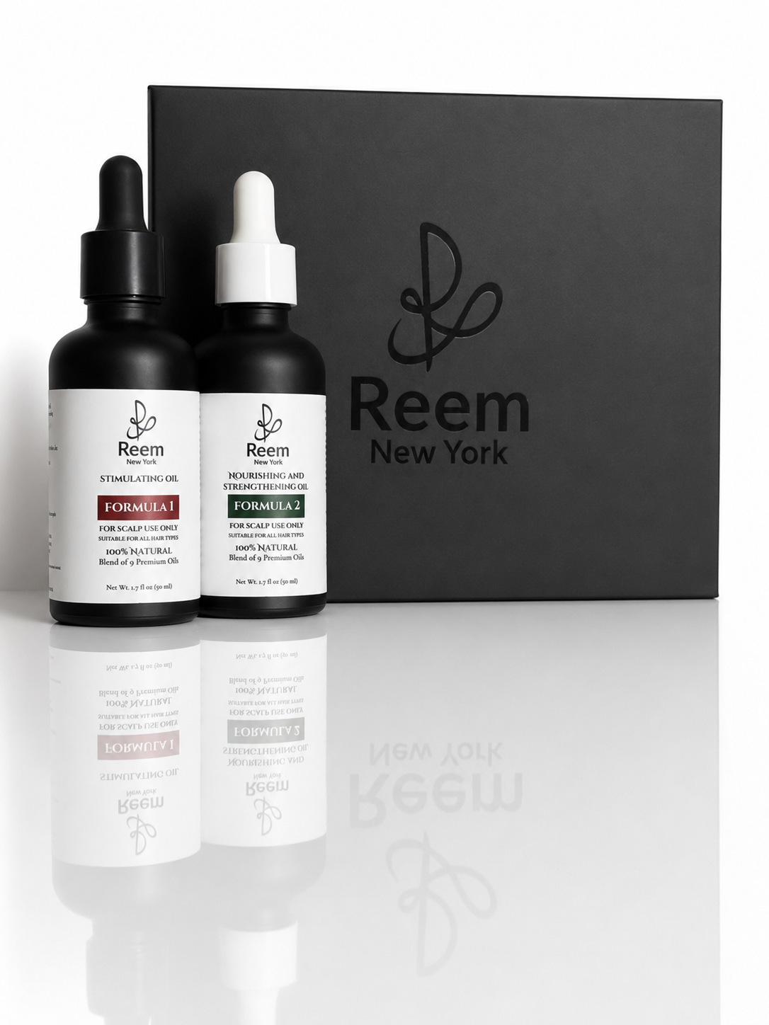 Two black bottles with white labels and a black box labeled 'Reem New York' on a reflective surface.